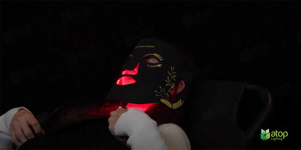 women sleeping using atop red light therapy beauty mask