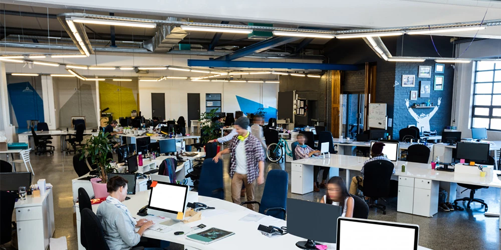 employee working in the office under LED lighting with warm white light